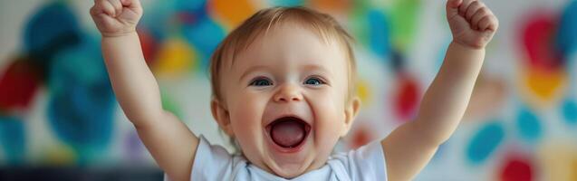 Excited toddler cheering with raised arms in a colorful background photo