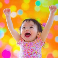 Cheering toddler with raised arms celebrating joyfully indoors photo
