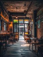 A cozy empty restaurant with natural light during the afternoon photo