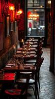 Cozy, empty restaurant with dim lighting and elegant table settings at dusk photo
