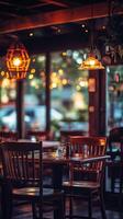 Cozy empty restaurant with warm lighting and wooden furniture at dusk photo