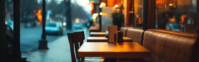 Cozy empty restaurant at dusk with warm lighting and inviting decor photo