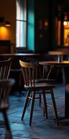 Cozy empty restaurant with wooden chairs and warm ambient lighting photo