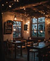A restaurant with tables and chairs in front of a window photo