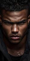 Athletic handsome man with intense expression in dark setting at dawn photo