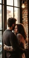 Cozy couple embraces by a window in a rustic cafe during sunset photo