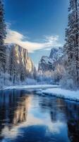 Majestic river valley with snow-covered cliffs under a clear blue sky photo