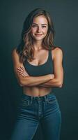 Portrait of a young woman confidently posing against a dark backdrop photo