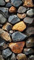 Background of dark and rusty sharp edged rocks forming a rough textured surface photo