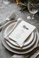 Elegant menu lying on plates at restaurant table setting photo
