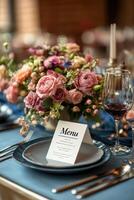 Elegant menu lying on table set for dinner in a restaurant photo