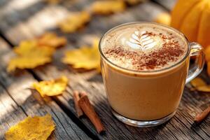 Steaming pumpkin spice latte sitting on rustic wooden table with autumn leaves photo