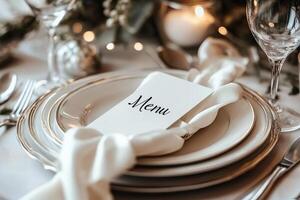 Elegant wedding reception table setting with menu and flowers photo
