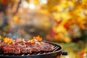 Delight in a warm and cozy autumn barbecue filled with expertly grilled meats, surrounded by the vibrant and rich colors of fall, all while enjoying a peaceful and inviting outdoor setting photo