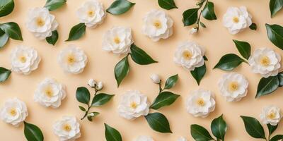 This beautiful flat lay features fragrant jasmine flowers and lush green leaves against a beige backdrop, creating a tranquil and captivating atmosphere that evokes serene beauty and natural elegance photo