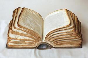 An imaginative open book made entirely of bread slices beautifully symbolizes scripture and sustenance, artfully merging spirituality with culinary creativity in a surreal, whimsical kitchen setting photo