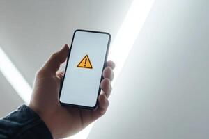A prominent visual warning displayed on a smartphone serves to signify possible financial risks that could include issues such as fraud, market caution, and various economic challenges looming ahead photo