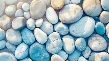 The beach is adorned with a stunning array of colorful and textured pebbles, creating a peaceful and harmonious scene photo