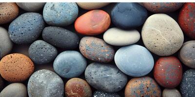 Diverse pebbles of various colors and textures, perfect for creating peaceful and vibrant backgrounds photo