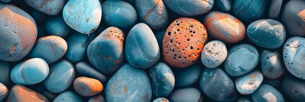 A beautiful array of river rocks with different sizes and textures, creating a colorful and calming composition photo