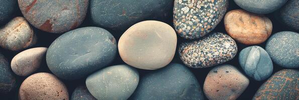 This image features a closeup of colorful and smooth pebbles, suitable for nature and relaxationrelated themes photo