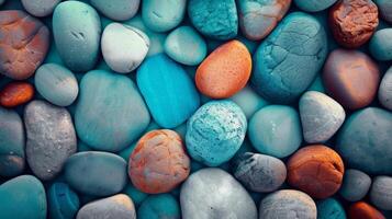 A vibrant collection of smooth, multicolored pebbles creating a visually engaging textured background. photo