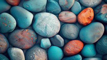 High-quality image of assorted colorful smooth river rocks, perfect for natural textures and backgrounds. photo