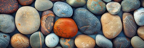 In a closeup view, colorful river stones form a pebble texture, creating a harmonious and balanced composition photo