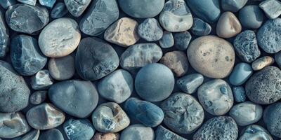 A captivating array of smooth beach stones with varying shapes and colors, showcasing nature's beauty. photo