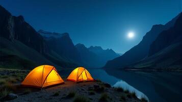 Serene Night-time Camping Scene in the Mountains. Clear Starry Sky With a Bright Full Moon Illuminating Landscape. photo