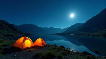 Serene Night-time Camping Scene in the Mountains. Clear Starry Sky With a Bright Full Moon Illuminating Landscape. photo
