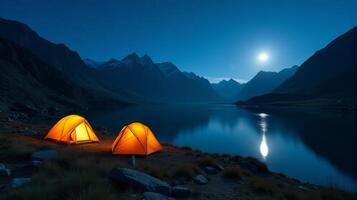 Serene Night-time Camping Scene in the Mountains. Clear Starry Sky With a Bright Full Moon Illuminating Landscape. photo