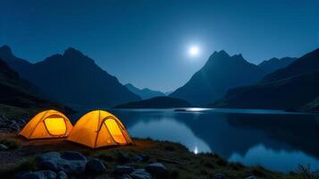Serene Night-time Camping Scene in the Mountains. Clear Starry Sky With a Bright Full Moon Illuminating Landscape. photo