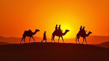 Silhouette of Camel Riders Against an Orange Hued Sky on a Desert Dunes Under Dramatic Sunset photo