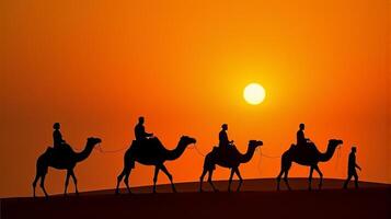 Silhouette of Camel Riders Against an Orange Hued Sky on a Desert Dunes Under Dramatic Sunset photo