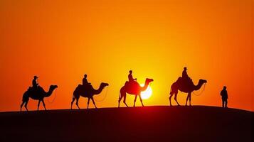 Silhouette of Camel Riders Against an Orange Hued Sky on a Desert Dunes Under Dramatic Sunset photo