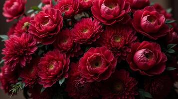 Dense Floral Arrangement of Red and Burgundy Shades Color Flowers photo