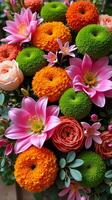 Intricate and Vibrant Floral Arrangement Featuring a Diverse Mix of Flowers photo