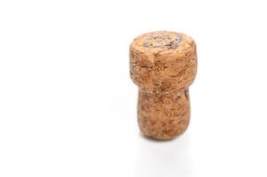 Cork from a bottle of champagne or sparkling wine, close-up photo of a cork isolated on a white background.