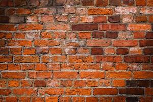 Red brick wall. Texture of old dark brown and red brick wall panoramic backgorund. photo