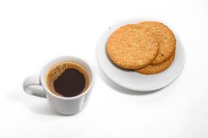 High angle view of coffee with cookies on a white background photo