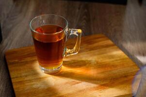 a cup of tea on a table. glass photo
