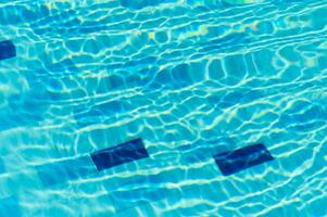 Swimming Pool Surface With Light Reflection and Water Ripple Patterns photo