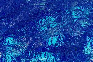 Swimming Pool Surface With Light Reflection and Water Ripple Patterns photo