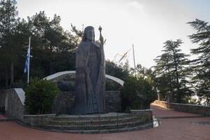monumental bronze statue of makarios the third, first president of cyprus and archbishop, in troodos mountains photo