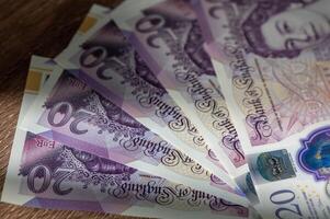 British currency - close up of the new 2016 polymer five pound note with enhanced counterfeit resilience. photo