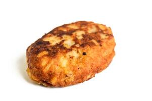 Fried cutlet in bread crumbs, isolated on the white background photo