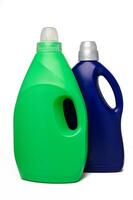Blue and green bottles of washing powder on white background. It has a white sticker for your image and text. photo