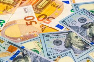 100 dollar and 50 euro bills as background photo