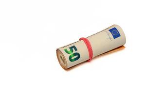 Close-up of a bundle of fifty euro bank notes bound with rubber band photo